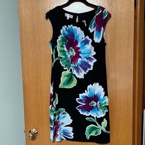 Women’s sleeveless, knee length dress made by London Style, size 6.
